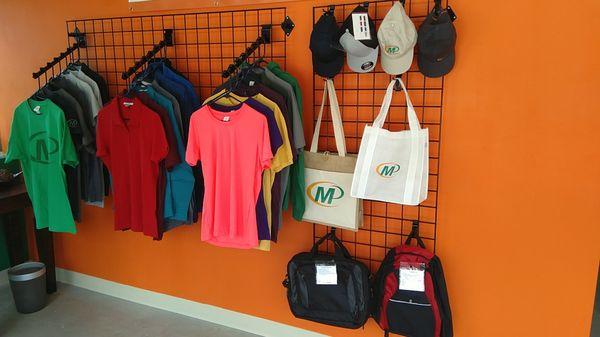 Custom branded T-shirts, polos, hats, and bags.