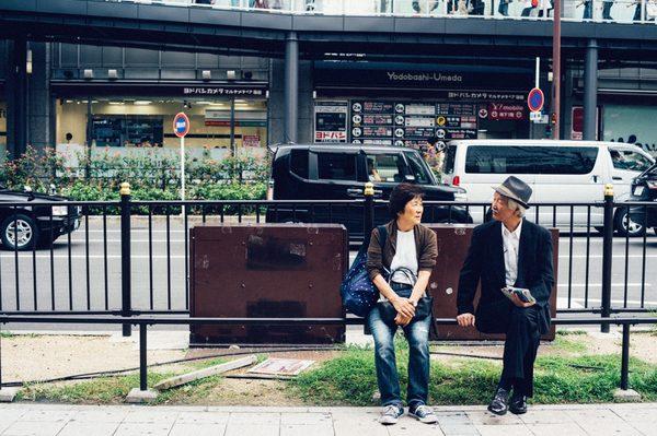 A couple sitting at the park.