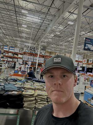 Incredibly handsome young man wearing a black shirt and hat near the electronics. Had to snap a pic--he definitely saw me, LOL!