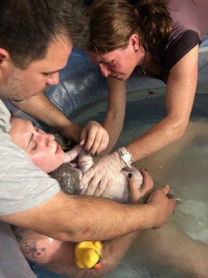 A moment of relief and satisfaction: holding your little one after working through labor.