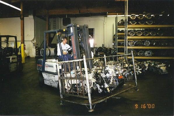 Aaron, at work unloading engines and transmissions from a new shipment off of the truck and into the warehouse.