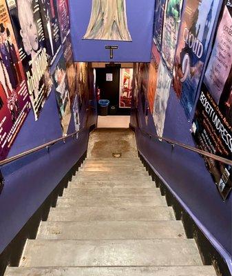 Down the stairs to the bar and bathrooms. There is also an elevator.