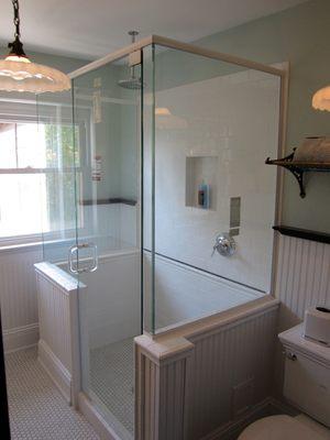 Heavy glass shower door enclosure installed