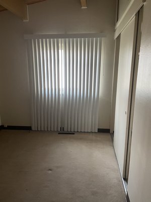 Blinds in larger bedroom that are missing blinds