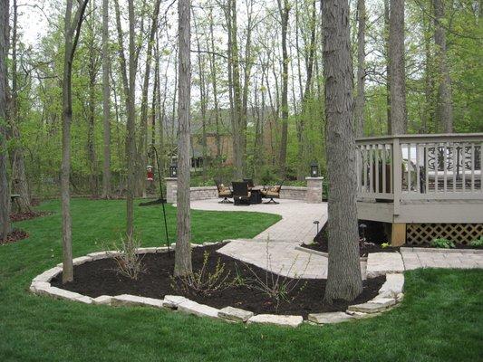 Complete redo of deck, sitting area and tree bed/border. Also reinstalled turf after construction