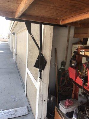 Removal of broken garage door hinge