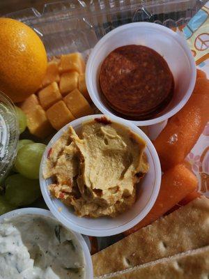 Roasted red pepper hummus, pepperoni. Dip for carrots, cheese, grapes, and a cutie orange.