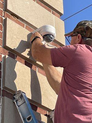 One of our technicians installing a Dahua exterior camera in 2023