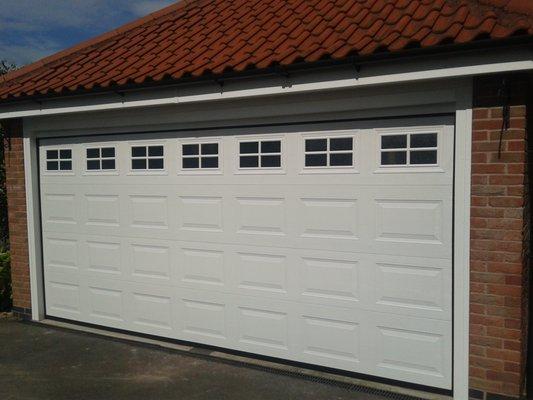 Short panel garage door white color w/windows