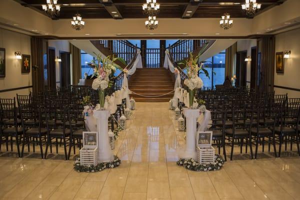 Aisle way, columns, tulle, garland, chalk boards, ceremony decor