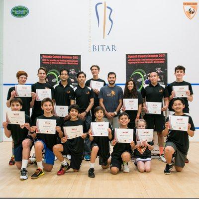 Play Squash Academy coaches with students