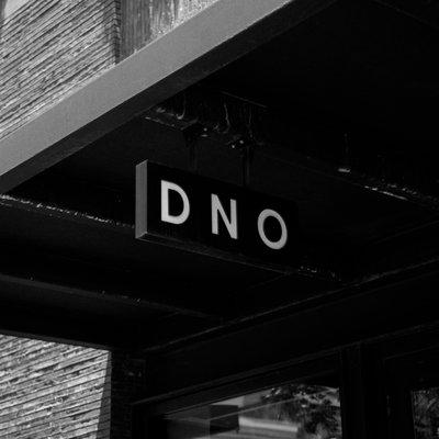 DNO New Orleans Downtown location attached to the Ace Hotel on Carondelet Street with hanging text logo signage.