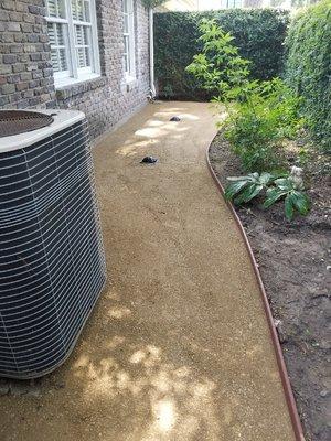 Bordered decomposed granite pathway is a clean and easy to maintain flooring that keeps the water at bay.