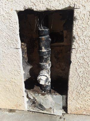 A cracked Sewer Dain Line in the wall is a common culprit of wet stucco behind the kitchen sink.