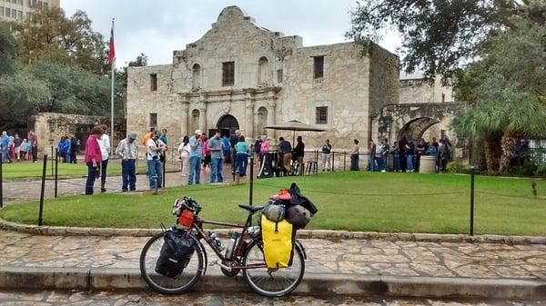 My touring bike in front of the Alamo.