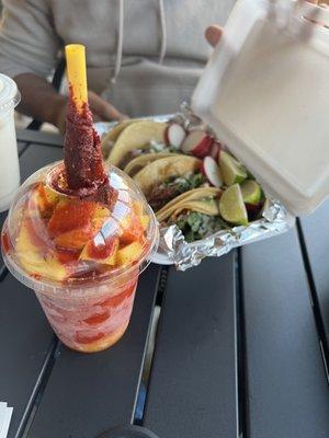 Tacos and mangonada drink.