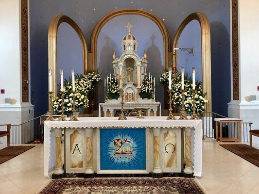 Altar decorated with Easter flowers.