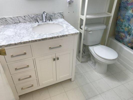 SImple bathroom update. New flooring and new vanity. SUCH A DIFFERENCE!