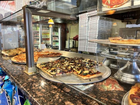 Gourmet pizzas on the counter