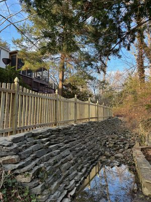 Pressure-treated fence with Gothic posts.