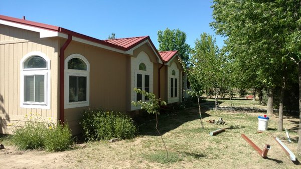 New metal roof rustic red 26 Gauge Paint entire house. White saddle tan and polar white fascia