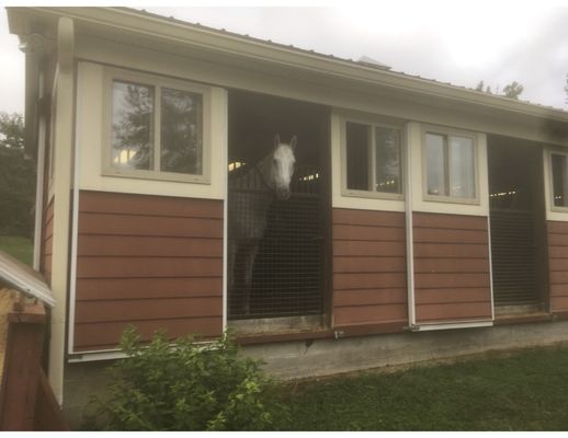 Open airy barn.  Back doors open to outside.