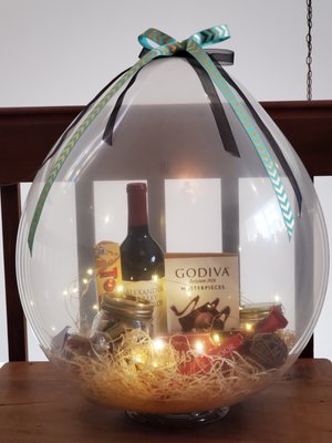 Balloon filled with gourmet chocolates and wine.