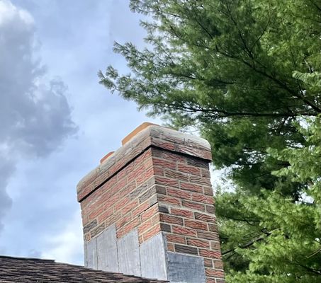 Chimney repaired
 - Replace top 8x12 flue
 - Repair cracks in cement crown 
 - Waterproof Chimney
 Looks brand new!