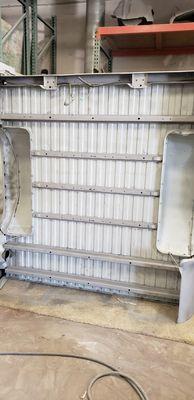 Underside of Chevy truck bed blasted clean.