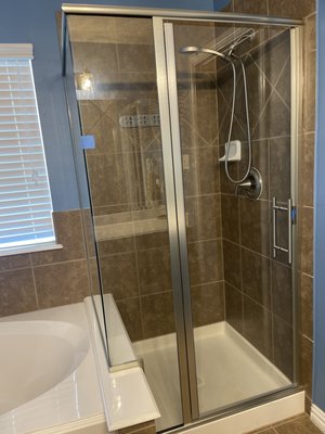 SEMI-FRAMLESS SHOWER ENCLOUSRE WITH PROTECTIVE COATING AND CUSTOMER ADDED THE LADDER PULL HANDLE