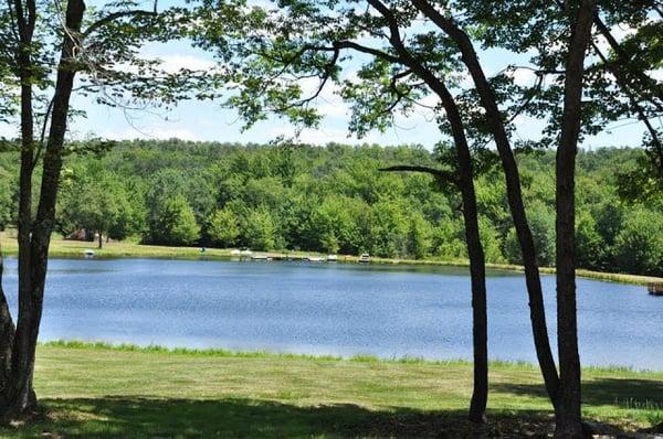 The view of our lake. We have catch and release fishing, a swimming area, and paddle boats for rent.