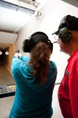 Dan helping a student at the basic pistol class.