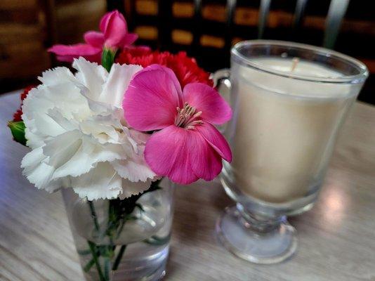 Fresh flowers and candles on every table.