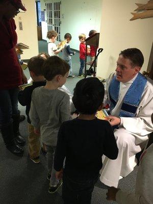 Greeting Father Greg at Wednesday Chapel.