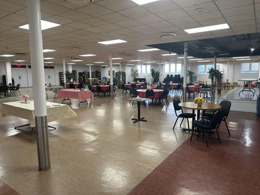 Our Community Room set up for a meal.  This large room can be configured lots of different ways to host meals, birthdays, parties, & more!