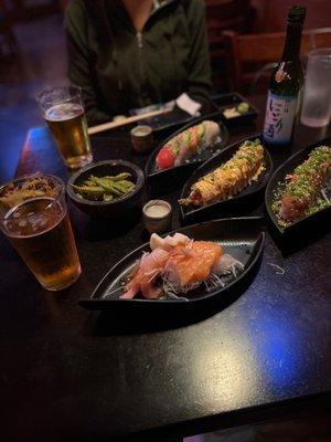 Three speciality rolls, sashimi happy hour, spicy edamame, two beers and a bottle of sake.