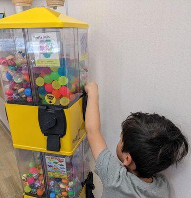 Hula Grins gives you a token to use on this cool toy machine at the end of your visit.