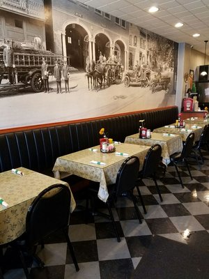 Inside the dining room with our Large black and white mural. It is a picture of Alexandria Fire Company. It is dated July 1920.