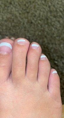 Second toe is painted / sideways a d these are white tip she basically did half my toenail!