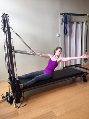 Tru Pilates owner Robin Truxel having fun on the tower!