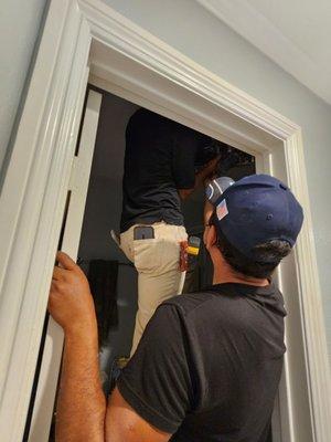 Frank and Danny working hard on replacing the bathroom fan