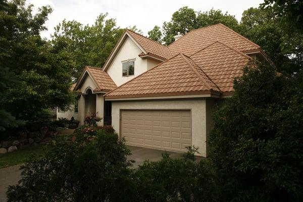 This roof was installed over an an existing wood shake roof. All our roofs are installed over existing roofing, with no tear-off