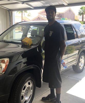 Terence and my now-secured Honda.