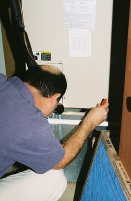 David Goldberg inspecting the water heater