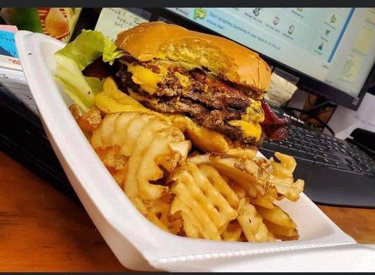 double meat double cheeseburger with bacon and a side of waffle fries