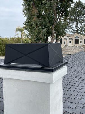 Chimney cap with a very beautiful, detailed crossbracing.