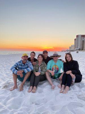 Family enjoying the white sand beach steps away from our rental