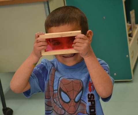 A preschooler gets creative with blocks.