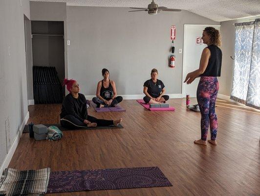 Bridget introducing her vinyasa flow to her students.