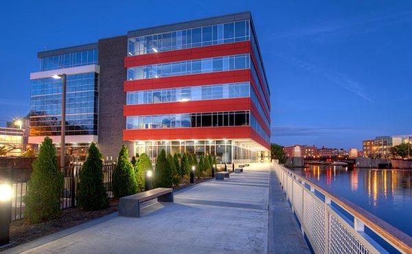 View of west side of building and river walk.